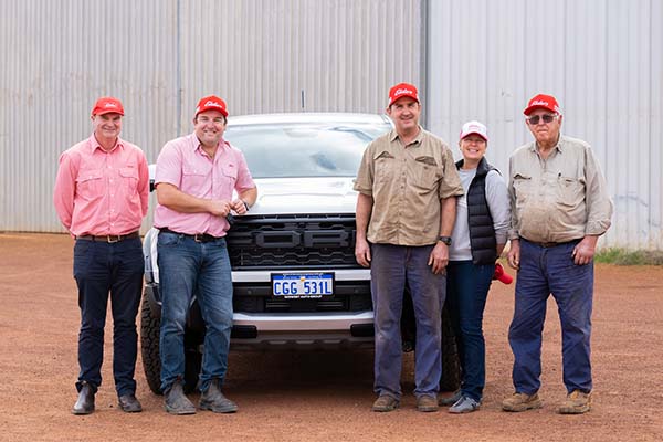 Area Manager Jason Clarke and Mingenew Branch Manager Jarrad Kupsch hand over the keys to winning clients Murray, Annette and Ian Thomas.