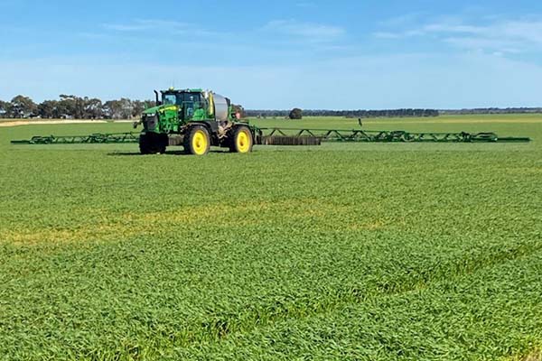 Boom sprayet on a lush green crop