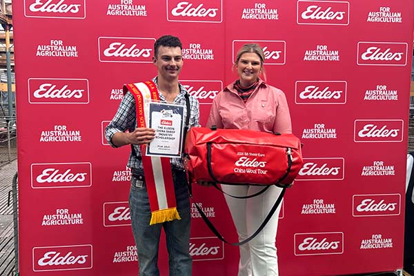 Jacob Scales with Elders Carly Gogel awarding him the prize trip to China.